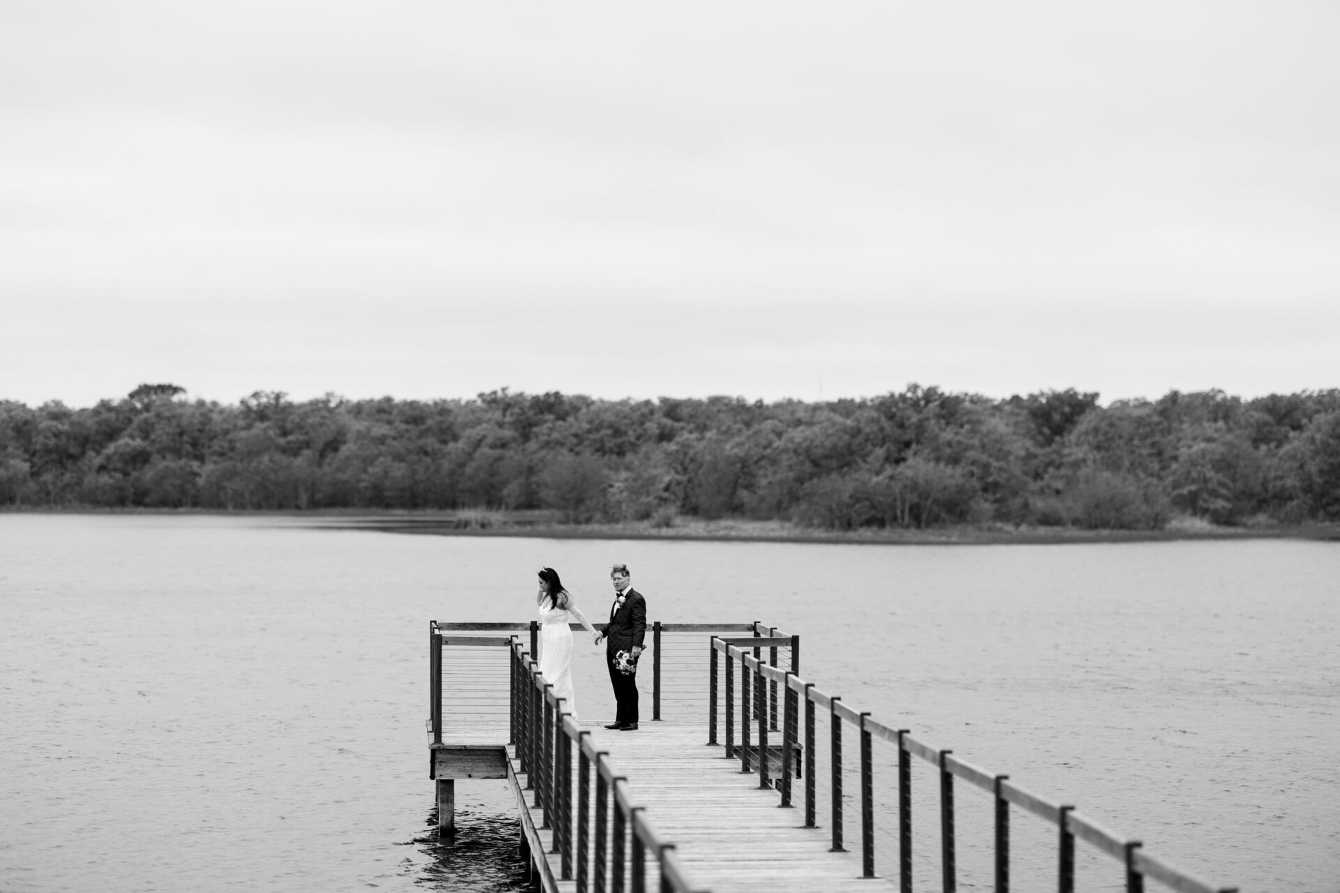 Bride and groom on a pier